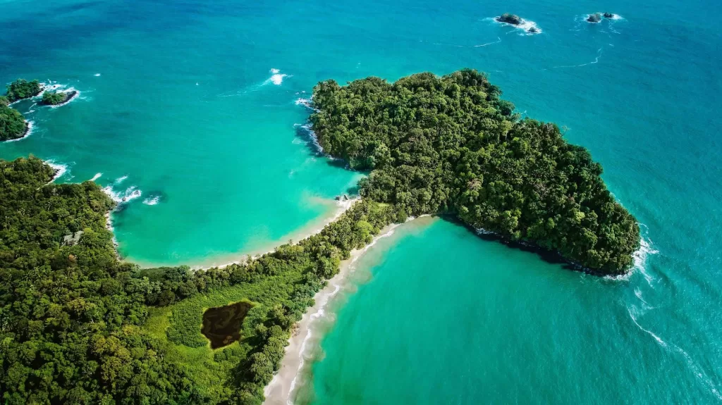 An aerial shot of the beaches at the tip of manuel antonio national park