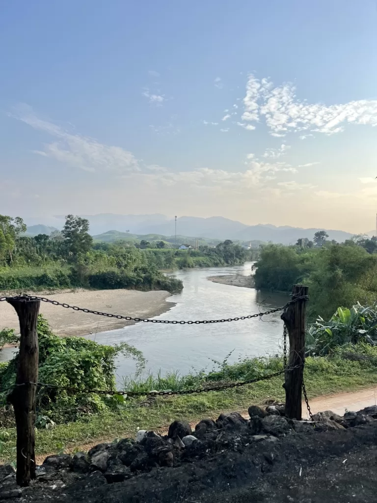 view of river with mountains in the background